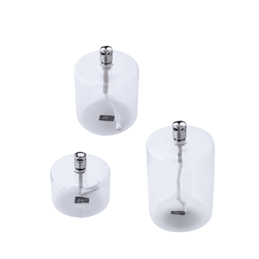 Drie Cylinder olielampen van Peri Living in transparant glas, in verschillende hoogtes.