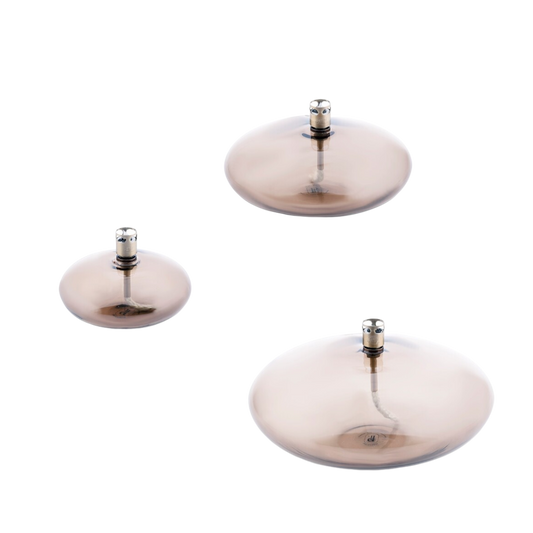 Drie Disc olielampen van Peri Living in champagnekleurig glas, in verschillende formaten.