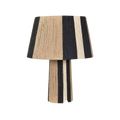 Subtile tafellamp van Opjet Paris met zwart-beige gestreepte jute kap en cilindervormige voet. 